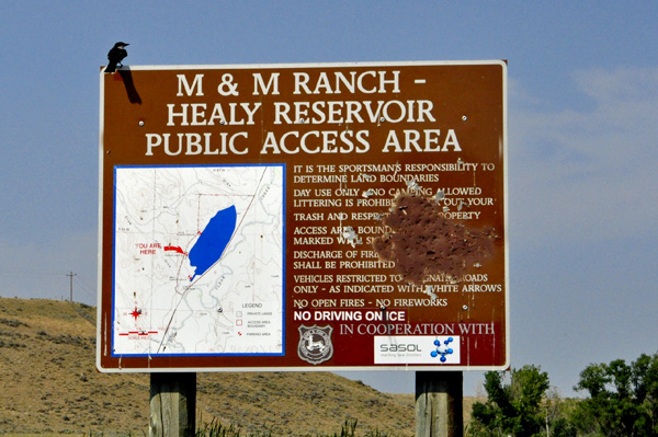 Healy Reservoir sign with a bird on it.